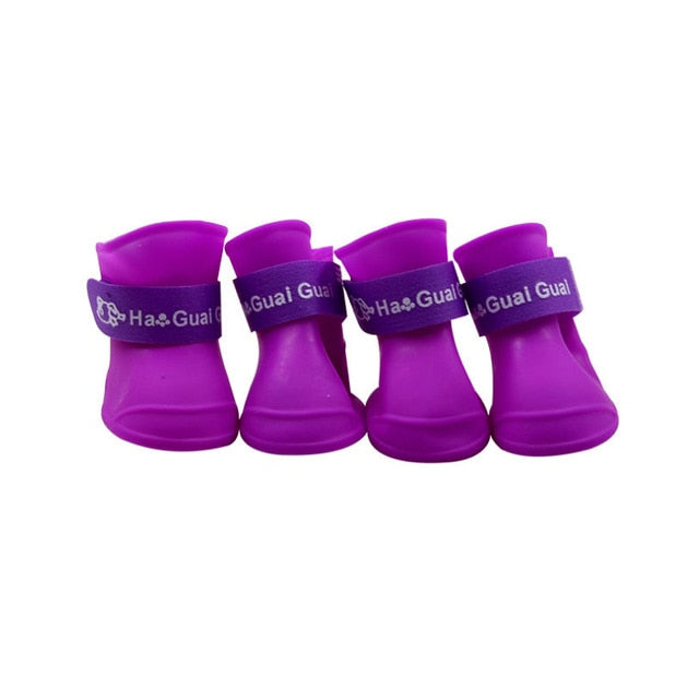 The pet dog boots with four silicone antiskid shoes wear waterproof dogs shoes candy colored pet rainy days appear essential